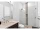 Bright bathroom with glass-enclosed shower, decorative tile, and modern fixtures at 15947 Vetta Dr, Bella Collina, FL 34756