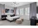 This bedroom features chic decor, soft lighting, and stylish curtains, creating a restful and elegant retreat at 15947 Vetta Dr, Bella Collina, FL 34756