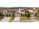 Attractive home showcasing well-manicured lawns and a paved driveway, combining curb appeal with practical design at 15947 Vetta Dr, Bella Collina, FL 34756