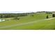 Scenic golf course views, featuring rolling green hills and manicured landscapes for recreational enjoyment at 15947 Vetta Dr, Bella Collina, FL 34756