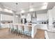 Spacious, modern kitchen with large island, stainless steel appliances, and stylish pendant lighting at 15947 Vetta Dr, Bella Collina, FL 34756
