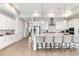 Spacious, modern kitchen with large island, stainless steel appliances, and stylish pendant lighting at 15947 Vetta Dr, Bella Collina, FL 34756