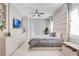 Serene bedroom with a padded headboard wall, a tv, and stylish furnishings at 15947 Vetta Dr, Bella Collina, FL 34756