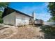 Backyard featuring a wooden deck with steps, perfect for outdoor living at 1617 Hallcrest Dr, Deltona, FL 32725