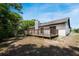 Backyard view showcasing a large wooden deck perfect for entertaining at 1617 Hallcrest Dr, Deltona, FL 32725