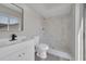 Bathroom featuring marble tiling in the shower, new fixtures, and natural light at 1617 Hallcrest Dr, Deltona, FL 32725