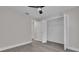 Bedroom with ceiling fan, updated flooring, and a closet with bi-fold doors at 1617 Hallcrest Dr, Deltona, FL 32725