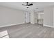 This bedroom has new floors, a ceiling fan, an ensuite bathroom, and natural light at 1617 Hallcrest Dr, Deltona, FL 32725