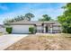 Charming single-story home showcasing a manicured lawn and inviting front entrance at 1617 Hallcrest Dr, Deltona, FL 32725