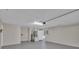 Spacious garage featuring painted walls, painted floor and water heater at 1617 Hallcrest Dr, Deltona, FL 32725