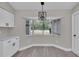 Kitchen nook with a bay window and wood floors at 1617 Hallcrest Dr, Deltona, FL 32725