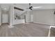 Open-concept living space with pristine floors, vaulted ceilings, and abundant natural light at 1617 Hallcrest Dr, Deltona, FL 32725