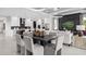 Open-concept living room featuring a gourmet kitchen, modern furnishings, and elegant decor at 1618 Bellagio Loop, Tavares, FL 32778