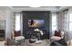 Inviting living room with fireplace and a mounted TV and comfortable seating at 1618 Bellagio Loop, Tavares, FL 32778