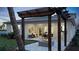 Inviting covered patio with a cozy fire pit, perfect for outdoor entertaining and relaxing with seamless access to indoor spaces at 1618 Bellagio Loop, Tavares, FL 32778