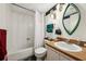 Bathroom featuring a tub/shower combo, and a vanity with a sink at 168 Perimeter Ct # 5C, Deltona, FL 32725