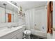 Bathroom with shower and tub, clean white tiles and modern sink at 168 Perimeter Ct # 5C, Deltona, FL 32725