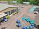 Outdoor community area with colorful seating, shuffle board and picnic tables for gatherings at 168 Perimeter Ct # 5C, Deltona, FL 32725