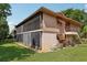 A charming exterior elevation showcasing the home's facade and screened-in porch at 168 Perimeter Ct # 5C, Deltona, FL 32725