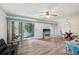Bright living room with wood floors, sliding doors, and modern furniture at 168 Perimeter Ct # 5C, Deltona, FL 32725
