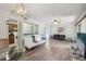 Bright and open living area with wood-look floors and a view of the kitchen at 168 Perimeter Ct # 5C, Deltona, FL 32725