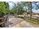 Wooden boardwalk with railings surrounded by lush greenery at 168 Perimeter Ct # 5C, Deltona, FL 32725