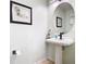 Modern bathroom with a pedestal sink and designer accents at 1757 Sunset Palm Dr, Apopka, FL 32712