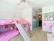Bright bedroom featuring playful decor and a fun bunk bed with a slide at 1757 Sunset Palm Dr, Apopka, FL 32712