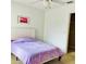 Comfortable bedroom showcasing a stylish headboard and view into the closet at 1757 Sunset Palm Dr, Apopka, FL 32712