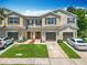 Charming townhome featuring a well-manicured lawn and private driveways at 1757 Sunset Palm Dr, Apopka, FL 32712