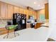 Inviting kitchen with stainless appliances, light wood cabinetry, and a bar-top counter at 1757 Sunset Palm Dr, Apopka, FL 32712