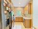Functional kitchen with tile floors, modern appliances, and ample cabinet space at 1757 Sunset Palm Dr, Apopka, FL 32712