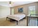 Neutral bedroom with a ceiling fan, two windows, and space for a bed and baby's crib at 1757 Sunset Palm Dr, Apopka, FL 32712