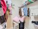Walk-in closet with wire shelving and organized storage for clothing and accessories at 1757 Sunset Palm Dr, Apopka, FL 32712