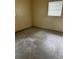 A bedroom with an outdated interior and window showing signs of neglect at 1822 Williams Manor Ave, Orlando, FL 32811