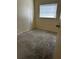 Image of a bare bedroom featuring a window for ample natural light, ready for customization at 1822 Williams Manor Ave, Orlando, FL 32811