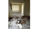 Debris-covered living room with window for natural light, awaiting restoration at 1822 Williams Manor Ave, Orlando, FL 32811