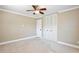 Bedroom featuring a ceiling fan, crown moulding, closet, and bright windows at 2320 Wekiva Ridge Rd, Apopka, FL 32712