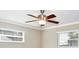Light bedroom featuring a ceiling fan, crown moulding, and two bright windows at 2320 Wekiva Ridge Rd, Apopka, FL 32712