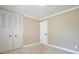 Comfortable bedroom with closet and neutral carpet, ready for relaxation at 2320 Wekiva Ridge Rd, Apopka, FL 32712