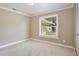 Bedroom with window and neutral carpet, ready for personalization at 2320 Wekiva Ridge Rd, Apopka, FL 32712