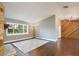 Spacious living room with wood floors, a stone fireplace, and ample natural light at 2320 Wekiva Ridge Rd, Apopka, FL 32712