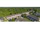 An aerial view of beautiful townhomes surrounded by lush green trees in a lovely community at 2346 Silver Palm Dr, Kissimmee, FL 34747