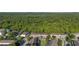 Aerial view shows a community of townhomes with lush surroundings and convenient parking at 2346 Silver Palm Dr, Kissimmee, FL 34747