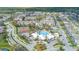 Aerial view of the community showcasing the clubhouse, pool, and tennis courts at 2346 Silver Palm Dr, Kissimmee, FL 34747