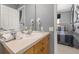 Bathroom featuring a single sink vanity, two hair dryers, and a view into the bedroom at 2346 Silver Palm Dr, Kissimmee, FL 34747