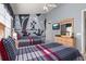 Charming bedroom featuring a Mickey Mouse themed wall mural and two comfortable beds at 2346 Silver Palm Dr, Kissimmee, FL 34747