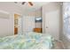 Bright bedroom with a mounted TV, adjacent bathroom, and closet space for added convenience at 2346 Silver Palm Dr, Kissimmee, FL 34747