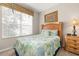 Cozy bedroom featuring a comfortable bed, natural light, and tasteful decor for a relaxing ambiance at 2346 Silver Palm Dr, Kissimmee, FL 34747