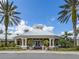 Charming clubhouse with inviting architecture, columns, and lush landscaping at 2346 Silver Palm Dr, Kissimmee, FL 34747